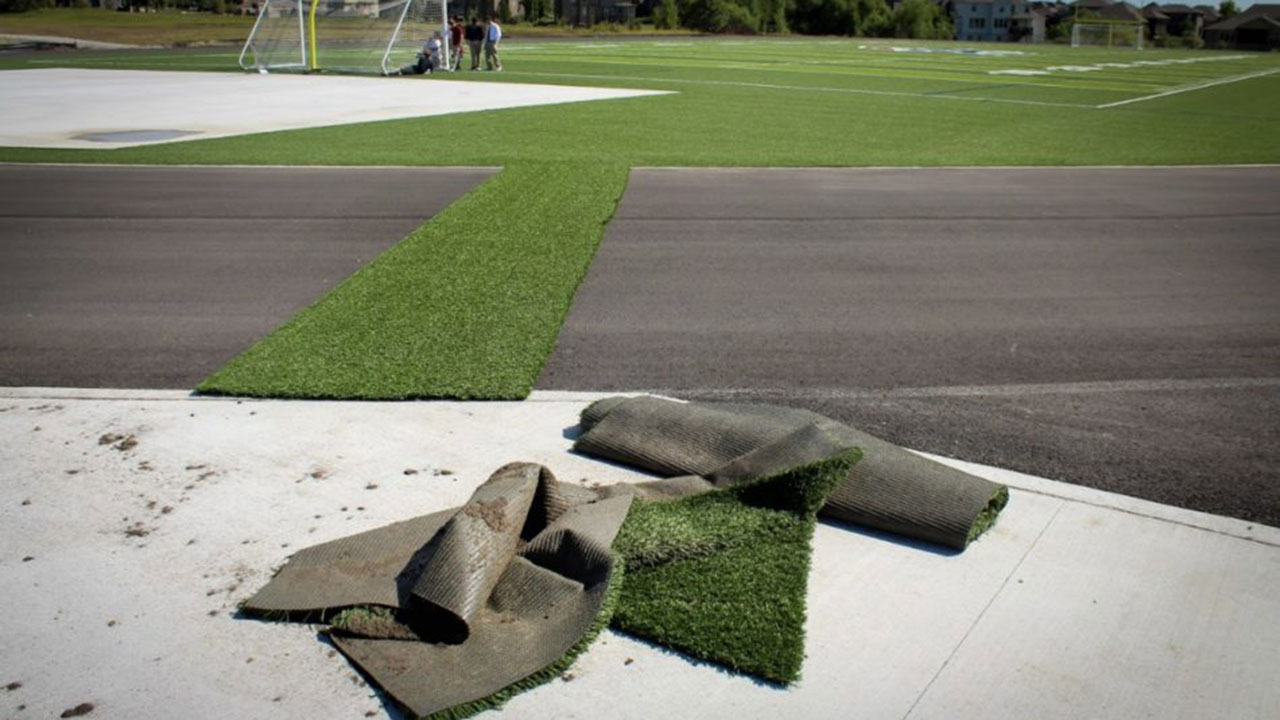 Installing premium turf and perfecting the supporting subgrade is a careful process.