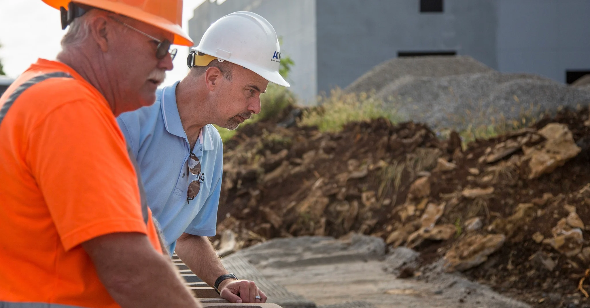 Geotechnical engineer Allan Bush examines work