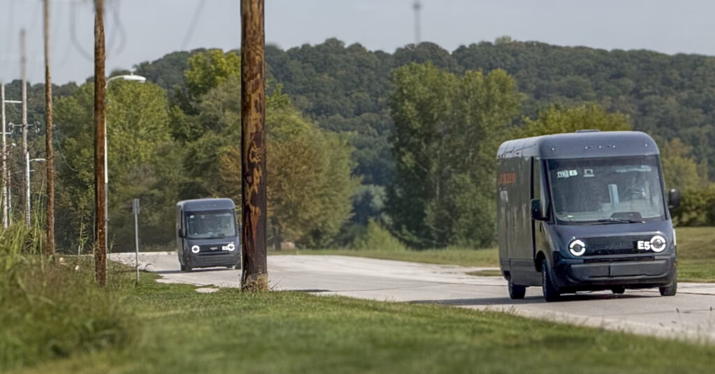 delivery trucks pulling out of parking lot