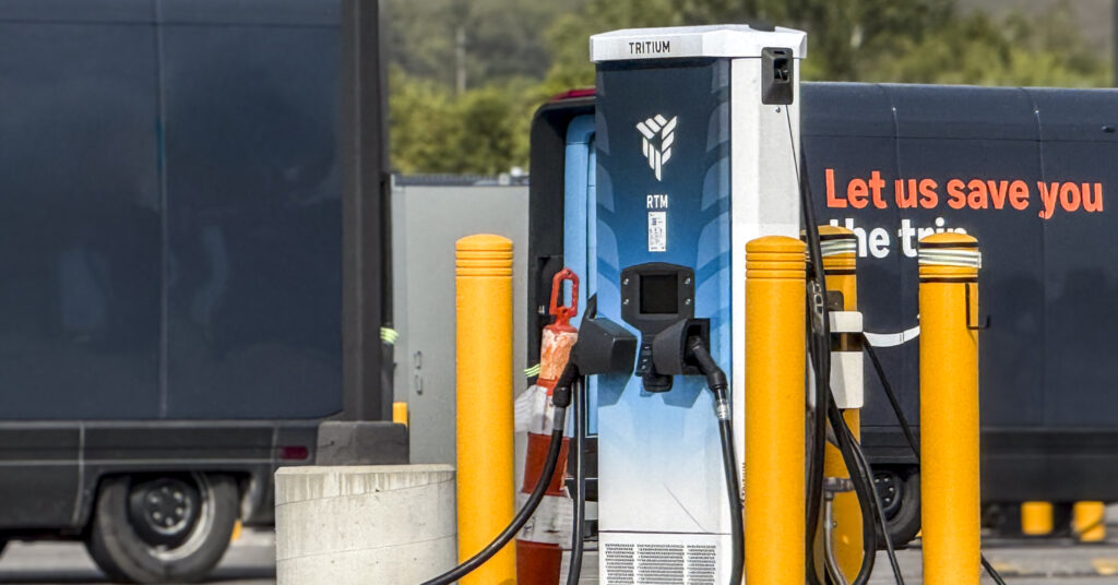charging station with vehicles in the background